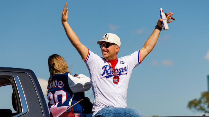 Nov 3, 2023; Arlington, TX, USA; Texas Rangers first baseman Nathaniel Lowe (30) acknowledges the fans during the World Series championship parade at Globe Life Field.  Mandatory Credit: Andrew Dieb-Imagn Images