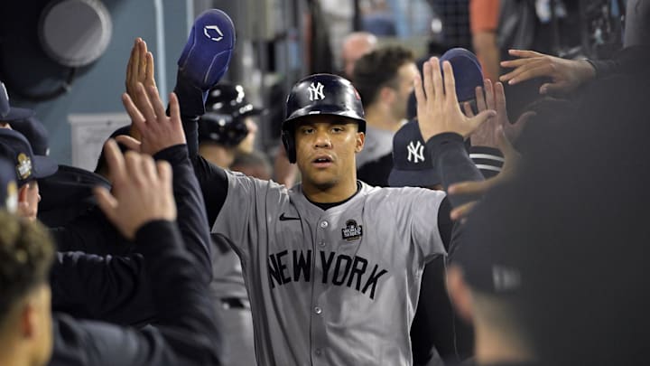 Oct 26, 2024; Los Angeles, California, USA; New York Yankees outfielder Juan Soto (22) celebrates in the dugout after scoring on an RBI single by designated hitter Giancarlo Stanton (not pictured) in the ninth inning against the Los Angeles Dodgers during game two of the 2024 MLB World Series at Dodger Stadium. Mandatory Credit: Jayne Kamin-Oncea-Imagn Images Oct 26, 2024; Los Angeles, California, USA; New York Yankees outfielder Juan Soto (22) celebrates in the dugout after scoring on an RBI single by designated hitter Giancarlo Stanton (not pictured) in the ninth inning against the Los Angeles Dodgers during game two of the 2024 MLB World Series at Dodger Stadium. Mandatory Credit: Jayne Kamin-Oncea-Imagn Images