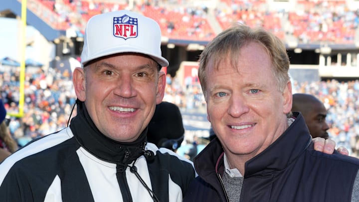 Jan 22, 2022; Nashville, Tennessee, USA; NFL commissioner Roger Goodell (right) poses with referee Clete Blakeman during a AFC Divisional playoff football game between the Cincinnati Bengals and the Tennessee Titans at Nissan Stadium.  Mandatory Credit: Kirby Lee-Imagn Images
