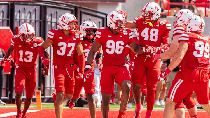 Sep 13, 2025; Lincoln, Nebraska, USA; Nebraska Cornhuskers defensive lineman Williams Nwaneri (96) and defensive back Caden VerMaas (48) celebrate after a fumble return for a touchdown against the Houston Christian Huskies during the second quarter at Memorial Stadium. Mandatory Credit: Dylan Widger-Imagn Images