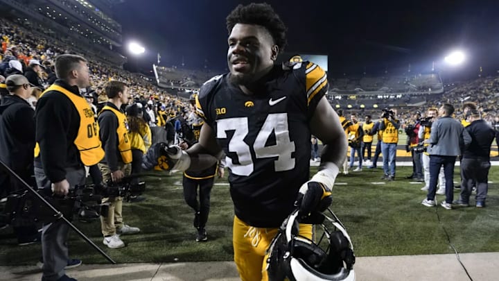 Iowa linebacker Jay Higgins (34) runs off the field after an NCAA college football game against Illinois, Saturday, Nov. 18, 2023, in Iowa City, Iowa. Iowa linebacker Jay Higgins will enter the Big Ten championship game against Michigan on Saturday with 141 tackles, most among players at Power Five conference schools. (AP Photo/Charlie Neibergall, File)