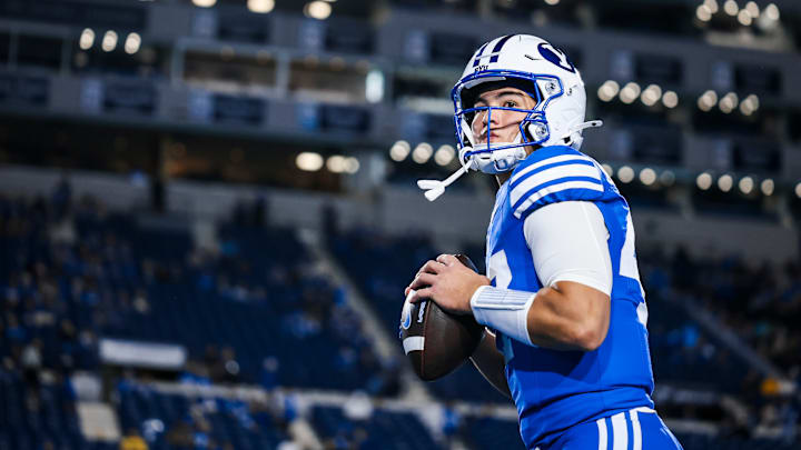 BYU quarterback Bear Bachmeier warms up for BYU's game against WVU