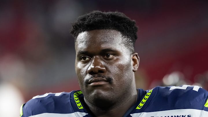 Seattle Seahawks center Olu Oluwatimi on the sidelines