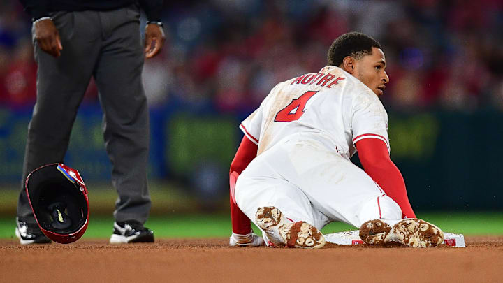 Sep 26, 2025; Anaheim, California, USA; Los Angeles Angels second baseman Christian Moore (4) reaches second on a double against the Houston Astros during the fifth inning at Angel Stadium. Mandatory Credit: Gary A. Vasquez-Imagn Images