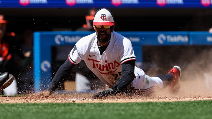 Minnesota Twins center fielder Byron Buxton scores on a two-run double hit by second baseman Brooks Lee during the eighth inning against the Baltimore Orioles at Target Field on May 8, 2025.