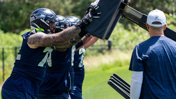 Jun 11, 2025; Renton, WA, USA; Seattle Seahawks offensive linemen including Abraham Lucas (72) take part in drills during mini-camp at Virginia Mason Athletic Center. 