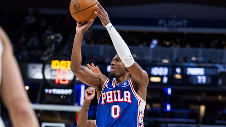 Feb 24, 2026; Indianapolis, Indiana, USA; Philadelphia 76ers guard Tyrese Maxey (0) shoots the ball while Indiana Pacers guard Kam Jones (7)  defends in the second half at Gainbridge Fieldhouse. Mandatory Credit: Trevor Ruszkowski-Imagn Images