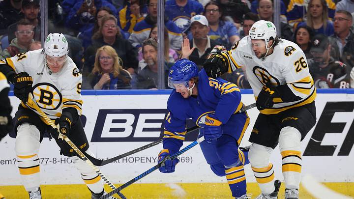 Apr 28, 2026; Buffalo, New York, USA; Buffalo Sabres right wing Josh Doan (91) controls the puck as Boston Bruins defenseman Andrew Peeke (26) defends during overtime in game five of the first round of the 2026 Stanley Cup Playoffs at KeyBank Center. Mandatory Credit: Timothy T. Ludwig-Imagn Images Apr 28, 2026; Buffalo, New York, USA; Buffalo Sabres right wing Josh Doan (91) controls the puck as Boston Bruins defenseman Andrew Peeke (26) defends during overtime in game five of the first round of the 2026 Stanley Cup Playoffs at KeyBank Center. Mandatory Credit: Timothy T. Ludwig-Imagn Images