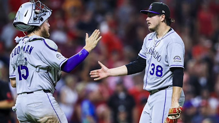 Jul 11, 2025; Cincinnati, Ohio, USA; Colorado Rockies catcher Hunter Goodman (15) high fives relief pitcher Victor Vodnik (38) after the victory over the Cincinnati Reds at Great American Ball Park. Jul 11, 2025; Cincinnati, Ohio, USA; Colorado Rockies catcher Hunter Goodman (15) high fives relief pitcher Victor Vodnik (38) after the victory over the Cincinnati Reds at Great American Ball Park.