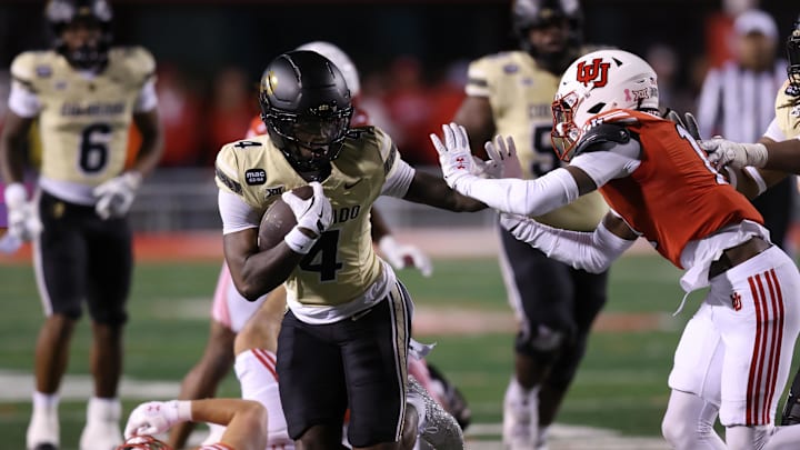 Colorado Buffaloes wide receiver Omarion Miller (4) runs against Utah Utes defensive back Rock Caldwell (11) during the second half at Rice-Eccles Stadium.