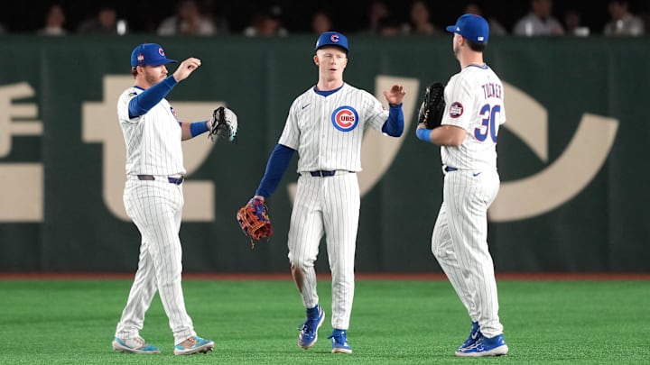 Mar 16, 2025; Bunkyo, Tokyo, Japan; Chicago Cubs center fielder Pete Crow-Armstrong (center) celebrates with right fielder Kyle Tucker (30) and left fielder Ian Happ (left) after defeating the Yomiuri Giants at Tokyo Dome. 