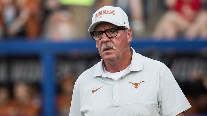 Texas Longhorns head coach Mike White walks to the coaches box in the seventh inning against the Mississippi State Bulldogs. Texas Longhorns head coach Mike White walks to the coaches box in the seventh inning against the Mississippi State Bulldogs.