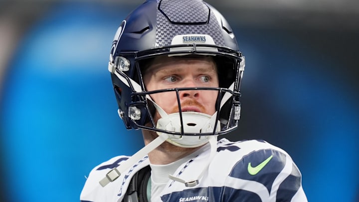 Dec 28, 2025; Charlotte, North Carolina, USA; Seattle Seahawks quarterback Sam Darnold (14) looks on before the game against the Carolina Panthers at Bank of America Stadium.