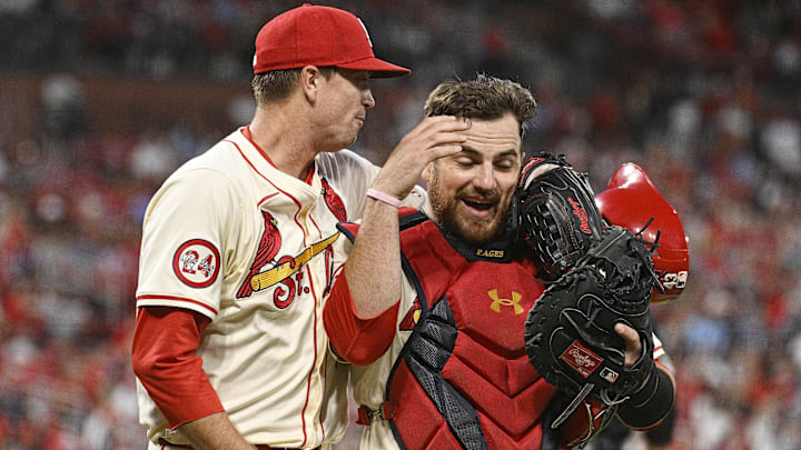 Sep 7, 2024; St. Louis, Missouri, USA; St. Louis Cardinals starting pitcher Kyle Gibson (44) and catcher Pedro Pages (43) celebrate after Gibson records his 1,500th career strike out against the Seattle Mariners in the fifth inning at Busch Stadium. Mandatory Credit: Joe Puetz-Imagn Images