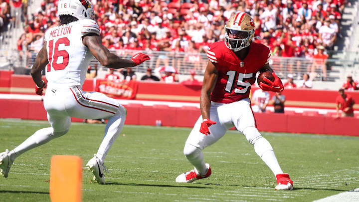 Oct 6, 2024; Santa Clara, California, USA; San Francisco 49ers wide receiver Jauan Jennings (15) controls the ball against Arizona Cardinals cornerback Max Melton (16) during the first quarter at Levi's Stadium. Mandatory Credit: Kelley L Cox-Imagn Images Oct 6, 2024; Santa Clara, California, USA; San Francisco 49ers wide receiver Jauan Jennings (15) controls the ball against Arizona Cardinals cornerback Max Melton (16) during the first quarter at Levi's Stadium. Mandatory Credit: Kelley L Cox-Imagn Images