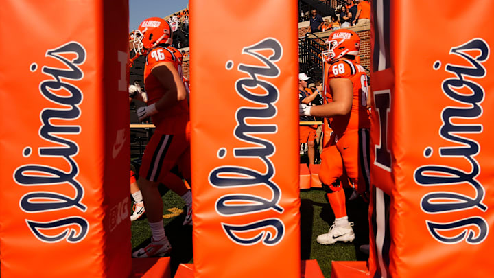 The Illinois Fighting Illini take the field prior to the NCAA football game against the Ohio State Buckeyes at Gies Memorial Stadium in Champaign on Oct. 11, 2025. The Illinois Fighting Illini take the field prior to the NCAA football game against the Ohio State Buckeyes at Gies Memorial Stadium in Champaign on Oct. 11, 2025.