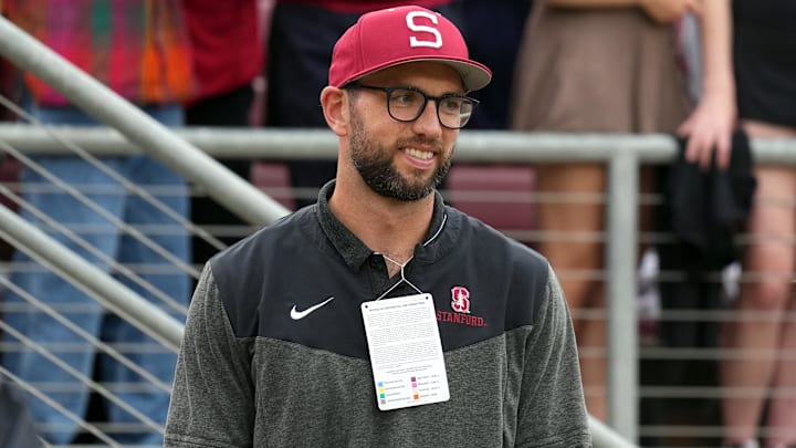 Stanford Cardinal and NFL former quarterback Andrew Luck stands on the sidelines during the second quarter against the Oregon Ducks at Stanford Stadium.