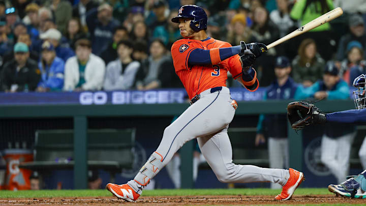 Apr 8, 2025; Seattle, Washington, USA; Houston Astros shortstop Jeremy Peña (3) hits a single against the Seattle Mariners during the fourth inning at T-Mobile Park. 