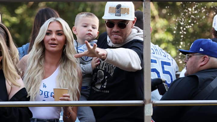 Los Angeles Dodgers first base Freddie Freeman (center) celebrates with his wife Chelsea Freeman and son on the bus during the Dodgers 2024 World Series Championship parade. Los Angeles Dodgers first base Freddie Freeman (center) celebrates with his wife Chelsea Freeman and son on the bus during the Dodgers 2024 World Series Championship parade.