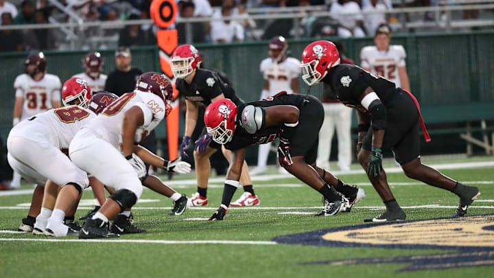 Savannah Christian's Elijah Griffin and LaDamion Guyton prepare for the snap on Friday, August 23, 2024 at Pooler Stadium.