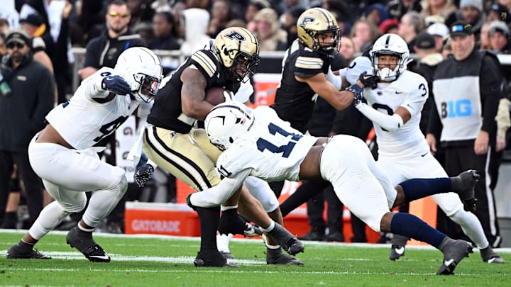 Penn State Nittany Lions defensive end Abdul Carter (11) tackles Purdue Boilermakers running back Reggie Love III during a game at Ross-Ade Stadium. 
