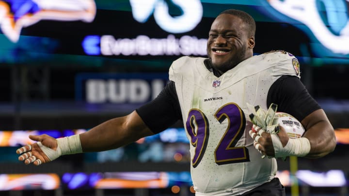 Dec 17, 2023; Jacksonville, Florida, USA;  Baltimore Ravens defensive tackle Justin Madubuike (92) celebrates after beating the Jacksonville Jaguars at EverBank Stadium. Mandatory Credit: Nathan Ray Seebeck-USA TODAY Sports