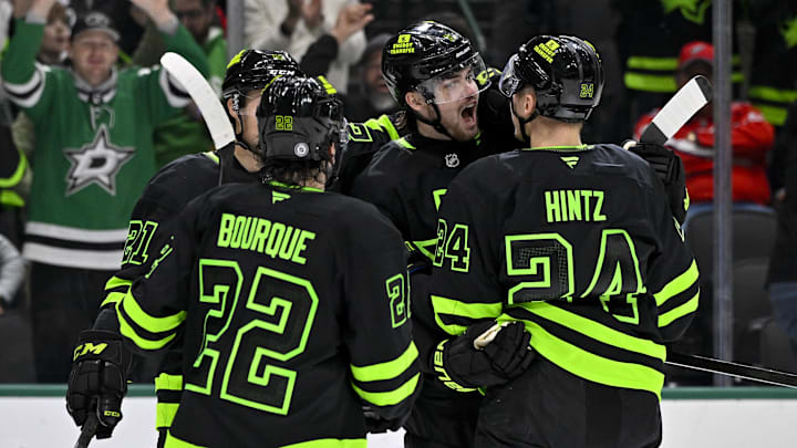 Dec 16, 2024; Dallas, Texas, USA; Dallas Stars center Mavrik Bourque (22) and defenseman Lian Bichsel (6) and center Roope Hintz (24) celebrates a goal scored by Bichsel against the Washington Capitals during the second period at the American Airlines Center. Mandatory Credit: Jerome Miron-Imagn Images