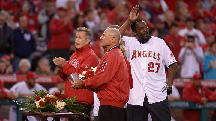 Mar 31, 2014; Anaheim, CA, USA; Former Angels outfielder Vladimir Guerrero waves to the crowd during a pre-game ceremonies prior to the opening day baseball game against the Seattle Mariners at Angel Stadium of Anaheim. Guerrero signed a one-day contract and officially announced his retirement. Mandatory Credit: Robert Hanashiro-USA TODAY Sports Mar 31, 2014; Anaheim, CA, USA; Former Angels outfielder Vladimir Guerrero waves to the crowd during a pre-game ceremonies prior to the opening day baseball game against the Seattle Mariners at Angel Stadium of Anaheim. Guerrero signed a one-day contract and officially announced his retirement. Mandatory Credit: Robert Hanashiro-USA TODAY Sports