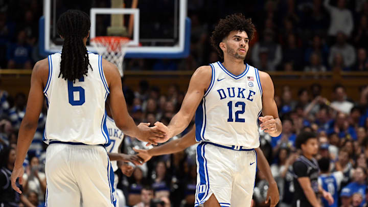 Nov 21, 2025; Durham, North Carolina, USA; Duke Blue Devils forward Cameron Boozer (12) reacts as he comes off the court during a break in the first half against the Niagara Purple Eagles at Cameron Indoor Stadium. Mandatory Credit: Rob Kinnan-Imagn Images