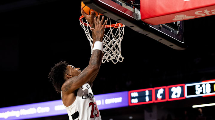 Cincinnati Bearcats forward Dillon Mitchell (23) hits a jump shot in the first half of a basketball scrimmage between Cincinnati Bearcats and Ohio State Buckeyes at Fifth Third Arena in Cincinnati on Friday, Oct. 18, 2024. Cincinnati Bearcats forward Dillon Mitchell (23) hits a jump shot in the first half of a basketball scrimmage between Cincinnati Bearcats and Ohio State Buckeyes at Fifth Third Arena in Cincinnati on Friday, Oct. 18, 2024.