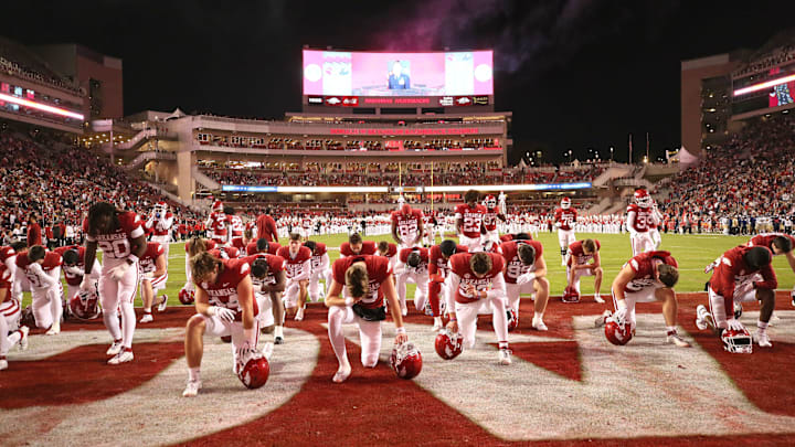 Nov 18, 2023; Fayetteville, Arkansas, USA; Arkansas Razorbacks players take a knee prior to the game against the FIU Panthers at Donald W. Reynolds Razorback Stadium. Arkansas won 44-20. Mandatory Credit: Nelson Chenault-USA TODAY Sports