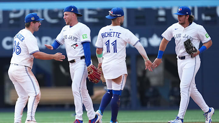 Aug 16, 2025; Toronto, Ontario, CAN; Toronto Blue Jays centre fielder Myles Straw (3) celebrates the win with left fielder Davis Schneider (36) against the Texas Rangers at the end of the ninth inning at Rogers Centre. Credit: Nick Turchiaro-Imagn Images