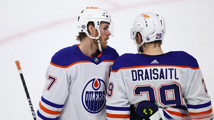 Edmonton Oilers center Connor McDavid talks with Leon Draisaitl