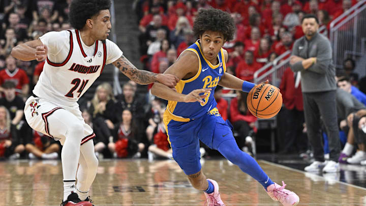 Mar 1, 2025; Louisville, Kentucky, USA;  Pittsburgh Panthers guard Brandin Cummings (3) dribbles against Louisville Cardinals guard Chucky Hepburn (24) during the first half at KFC Yum! Center. Louisville defeated Pittsburgh 79-68. Mandatory Credit: Jamie Rhodes-Imagn Images