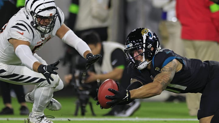 Jacksonville Jaguars wide receiver Parker Washington (11) fields a kickoff return as Cincinnati