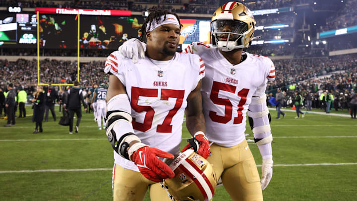 Jan 29, 2023; Philadelphia, Pennsylvania, USA; San Francisco 49ers linebacker Azeez Al-Shaair (51) and linebacker Dre Greenlaw (57) walk off the field after a loss to the Philadelphia Eagles in the NFC Championship game at Lincoln Financial Field. Mandatory Credit: Bill Streicher-Imagn Images