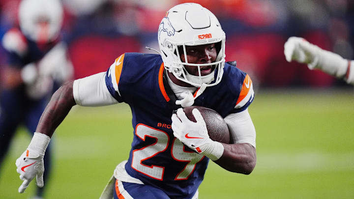 Dec 2, 2024; Denver, Colorado, USA; Denver Broncos cornerback Ja'Quan McMillian (29) returns an interception for a touchdown in the fourth quarter against the Cleveland Browns at Empower Field at Mile High. 