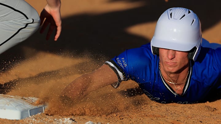 Trinity Christian's Merrick Beamish (4) makes it safely back to first base during the first inning of a high school baseball matchup Thursday, March 20, 2025 at Trinity Christian Academy in Jacksonville, Fla. Trinity Christian blanked Providence 10-0 in five innings.