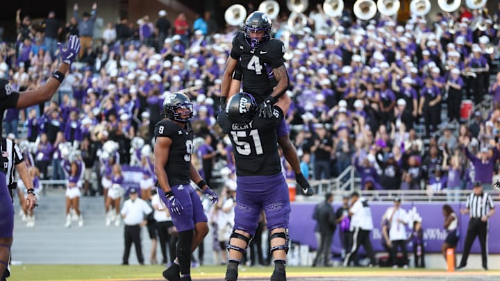 Nov 23, 2024; Fort Worth, Texas, USA; TCU Horned Frogs running back Cam Cook (4) celebrates with offensive lineman Coltin Deery (51) after scoring a touchdown against the Arizona Wildcats in the third quarter at Amon G. Carter Stadium. Mandatory Credit: Tim Heitman-Imagn Images