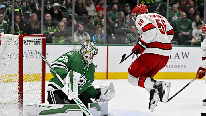 Feb 13, 2024; Dallas, Texas, USA; Carolina Hurricanes left wing Michael Bunting (58) leaps in front