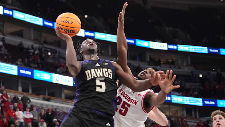Mar 12, 2026; Chicago, IL, USA; Wisconsin Badgers guard John Blackwell (25) defends Washington Huskies guard Zoom Diallo (5) during the second half at United Center. Mandatory Credit: David Banks-Imagn Images