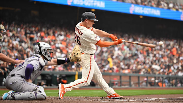 Sep 28, 2025; San Francisco, California, USA; San Francisco Giants third baseman Matt Chapman (26) hits a double against the Colorado Rockies in the fourth inning at Oracle Park. Mandatory Credit: Eakin Howard-Imagn Images