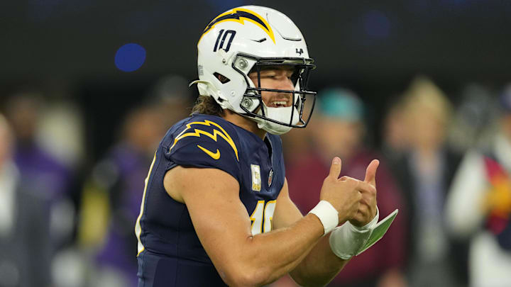 Nov 25, 2024; Inglewood, California, USA; Los Angeles Chargers quarterback Justin Herbert (10) reacts against the Baltimore Ravens in the first half at SoFi Stadium. Mandatory Credit: Kirby Lee-Imagn Images