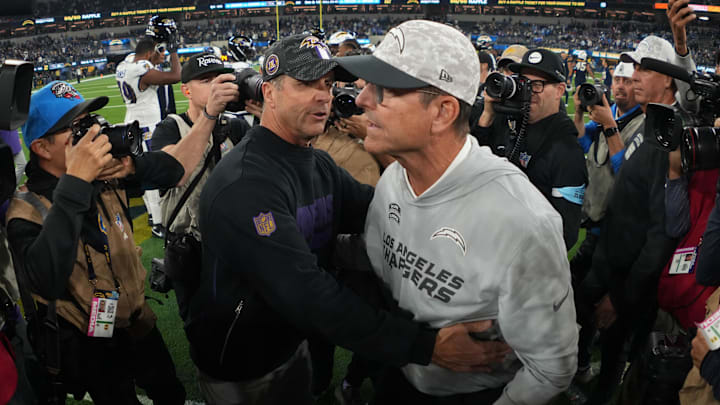 Nov 25, 2024; Inglewood, California, USA; Baltimore Ravens coach John Harbaugh (left) shakes hands with brother and Los Angeles Chargers coach Jim Harbaugh after the game at SoFi Stadium. Mandatory Credit: Kirby Lee-Imagn Images Nov 25, 2024; Inglewood, California, USA; Baltimore Ravens coach John Harbaugh (left) shakes hands with brother and Los Angeles Chargers coach Jim Harbaugh after the game at SoFi Stadium. Mandatory Credit: Kirby Lee-Imagn Images