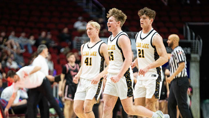 Thomas Meyer (51) and his Clear Lake teammates celebrate a win in the Class 3A semifinals over ADM.