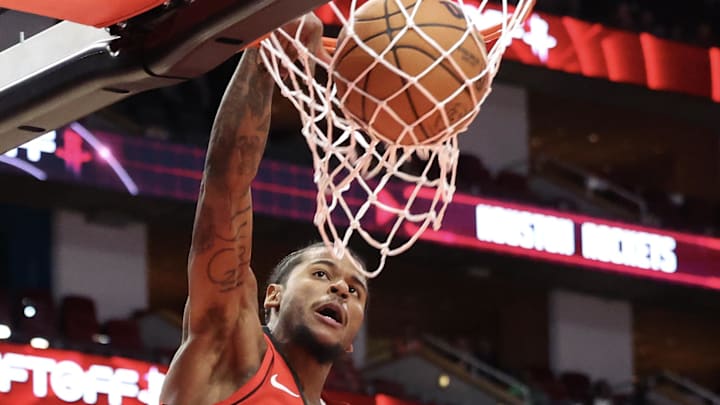 Nov 11, 2024; Houston, Texas, USA;  Houston Rockets guard Jalen Green (4) dunks against the Washington Wizards in the first quarter at Toyota Center. Mandatory Credit: Thomas Shea-Imagn Images
