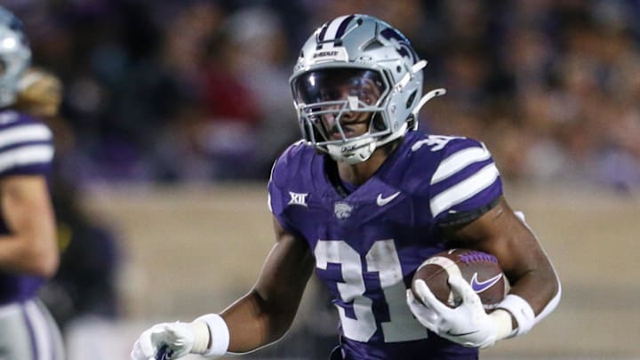Nov 16, 2024; Manhattan, Kansas, USA; Kansas State Wildcats running back DJ Giddens (31) runs the ball against the Arizona State Sun Devils during the third quarter at Bill Snyder Family Football Stadium. Mandatory Credit: Scott Sewell-Imagn Images