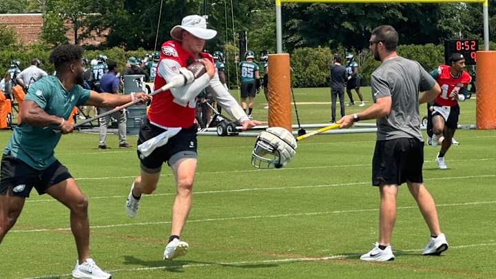 Eagles QB Tanner McKee works through ball-security drills during a recent OTA practice.