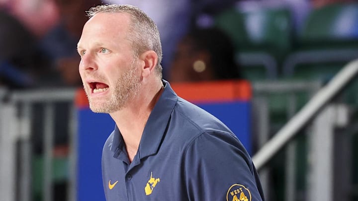 Nov 29, 2024; Paradise Island, Bahamas, BHS;  West Virginia Mountaineers head coach Darian DeVries reacts against the Arizona Wildcats during the first half at Imperial Arena at the Atlantis resort.  Mandatory Credit: Kevin Jairaj-Imagn Images