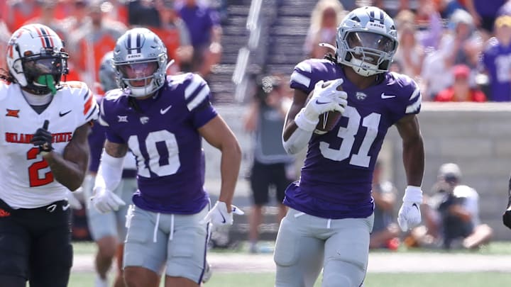 Sep. 28, 2024: DJ Giddens rushes against the Oklahoma State Cowboys in a regular season game at Bill Snyder Family Stadium in Manhattan, Kansas